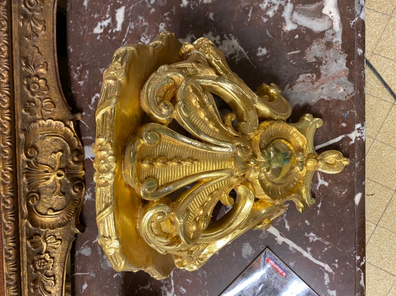 Golden wall applique with gold leaf