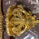 Golden wall applique with gold leaf