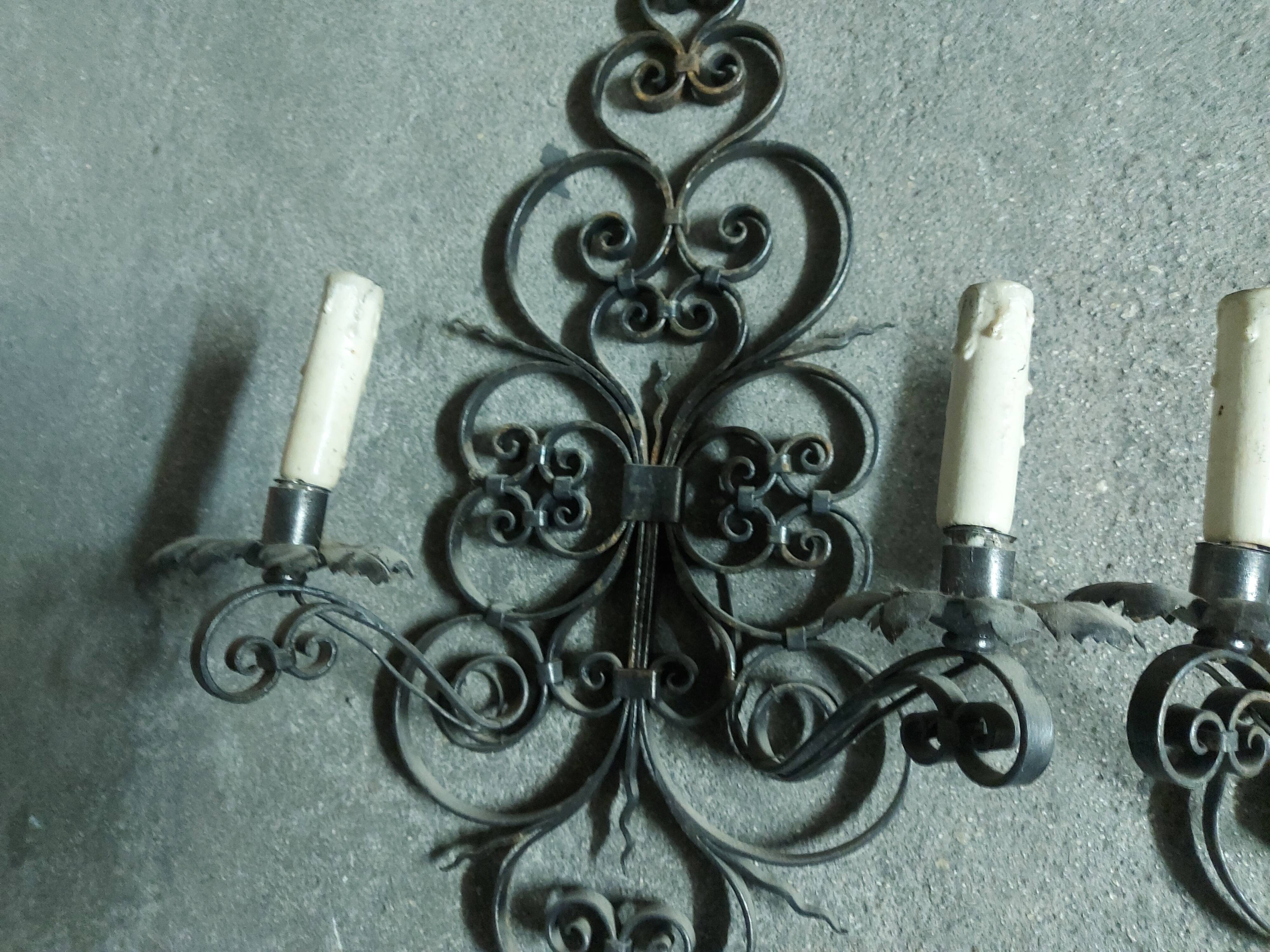 Two large wrought iron wall lights