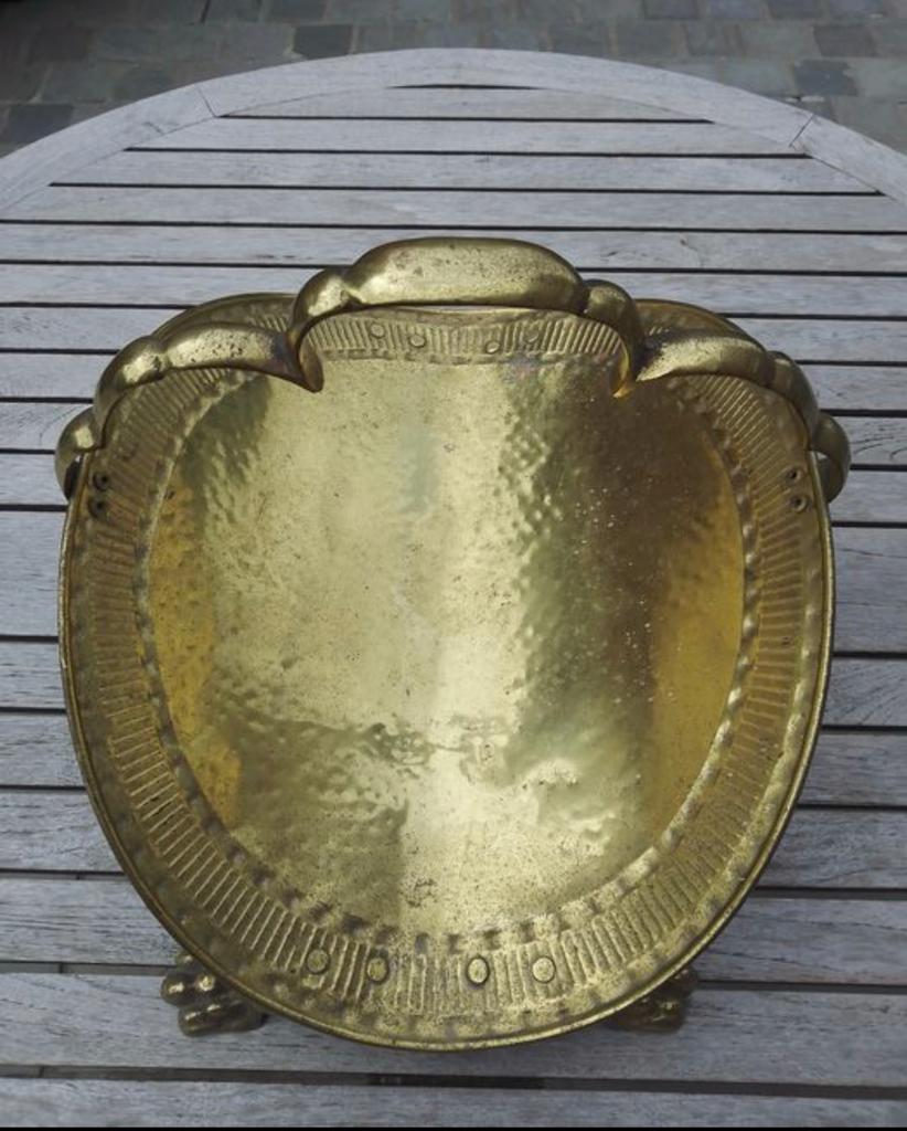 Old brass log holder