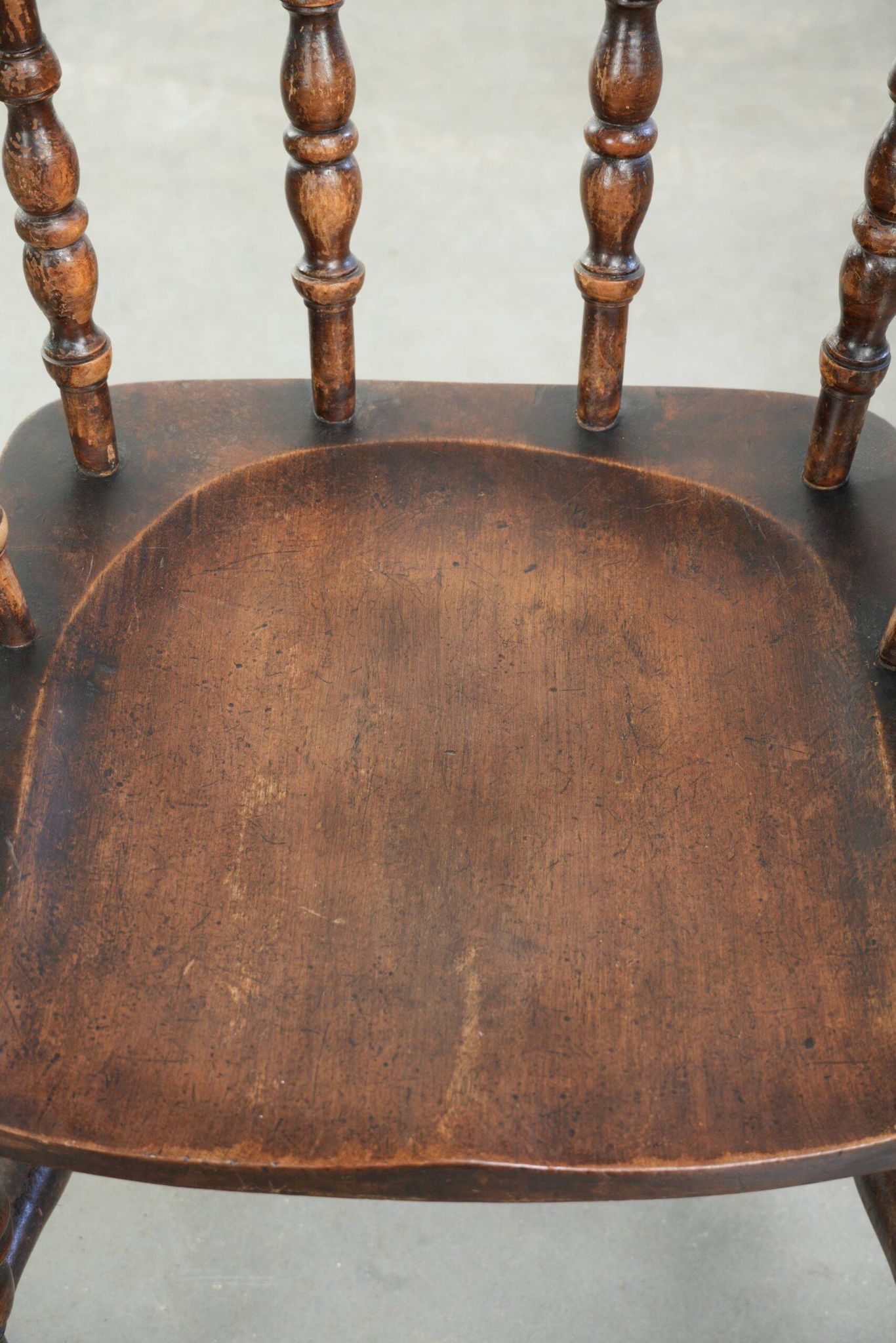 Wooden English antique pub/captain chair from the late 19th century