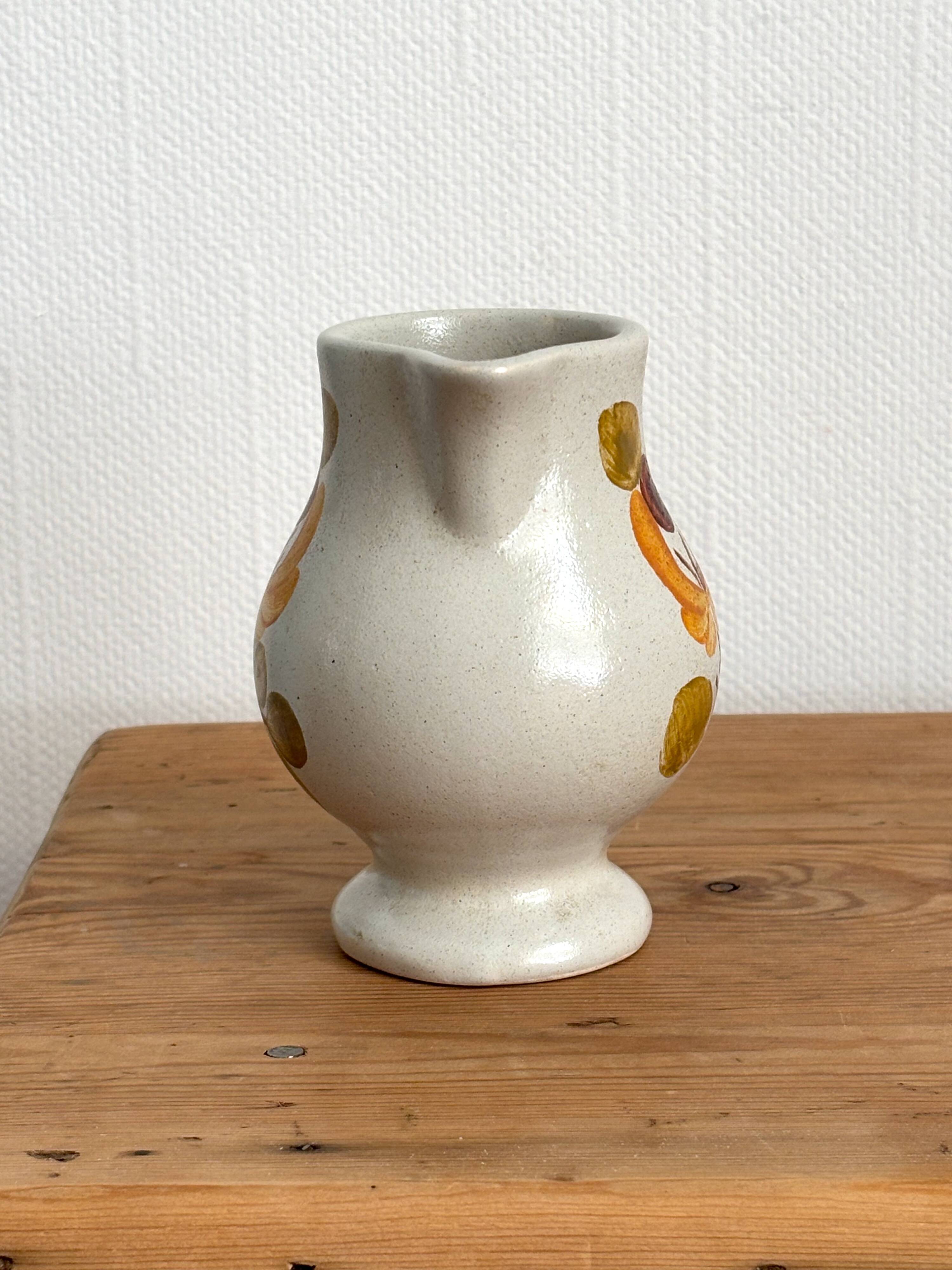 Vintage Maine St Amand earthenware pitcher with floral decorations