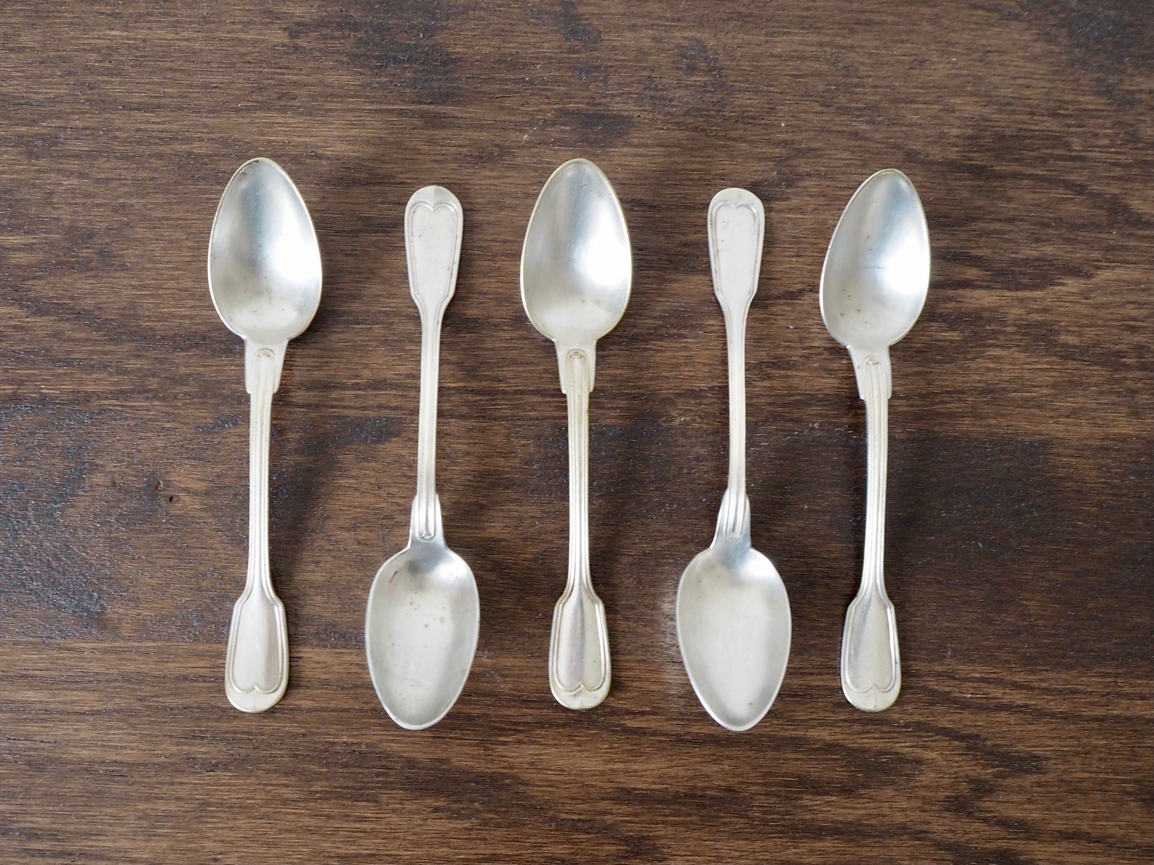 Set of 5 white metal spoons from the 20s