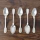 Set of 5 white metal spoons from the 20s