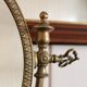 Oval mirror on psyche stand