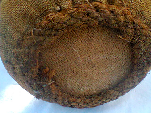 Demijohn dressed in burlap and padded cork