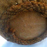 Demijohn dressed in burlap and padded cork