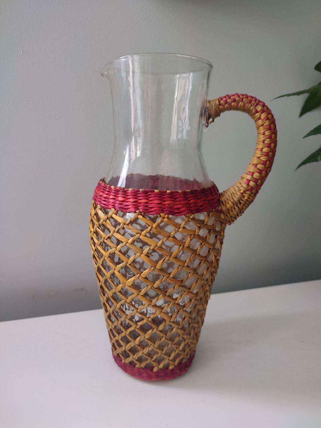Glass and raffia water carafe