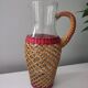 Glass and raffia water carafe