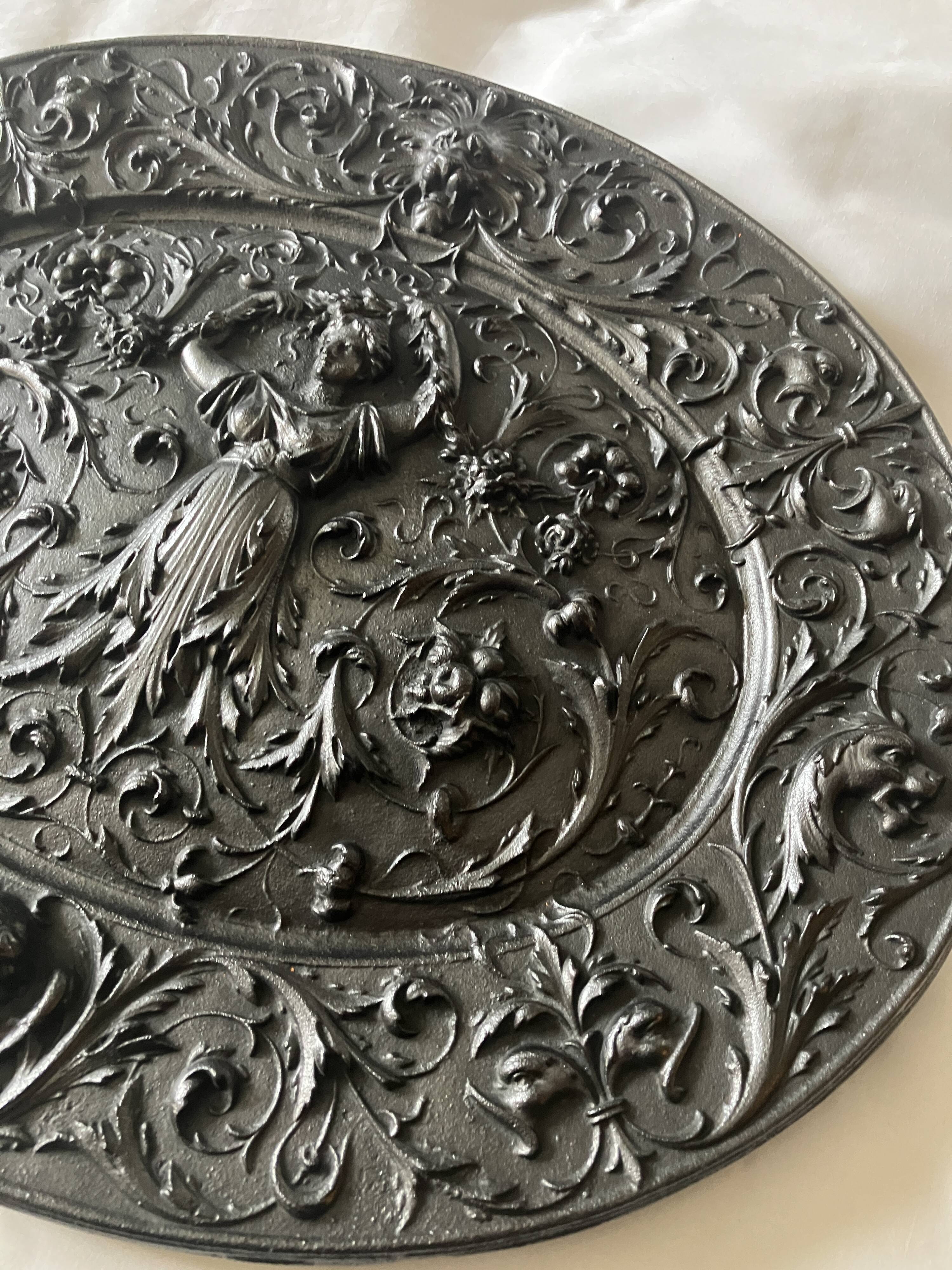 Plaque décorative en fonte début 20°siècle.