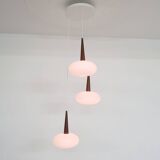Set of three milk glass and teak pendant lights model NG74 by Louis Kalff for Philips, The Netherlan