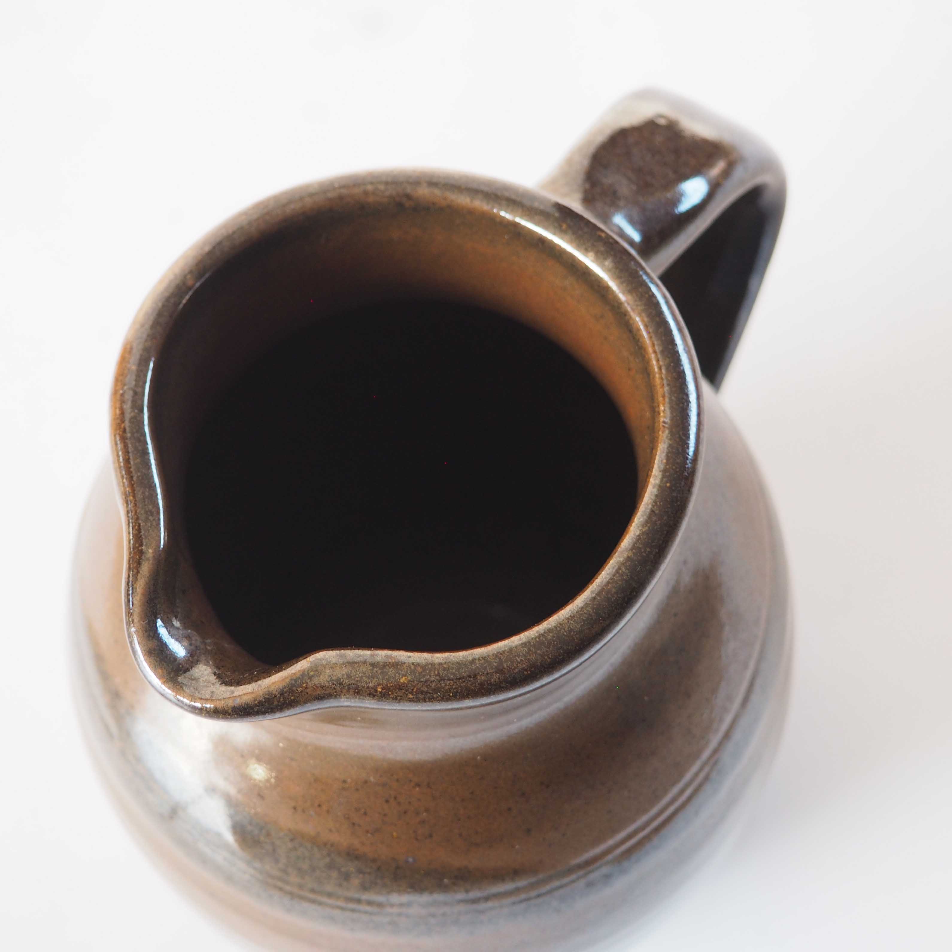 Duo of sandstone pitchers