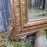 Wooden fireplace mirror and Gilded Louis XVI-style plaster with leaf
