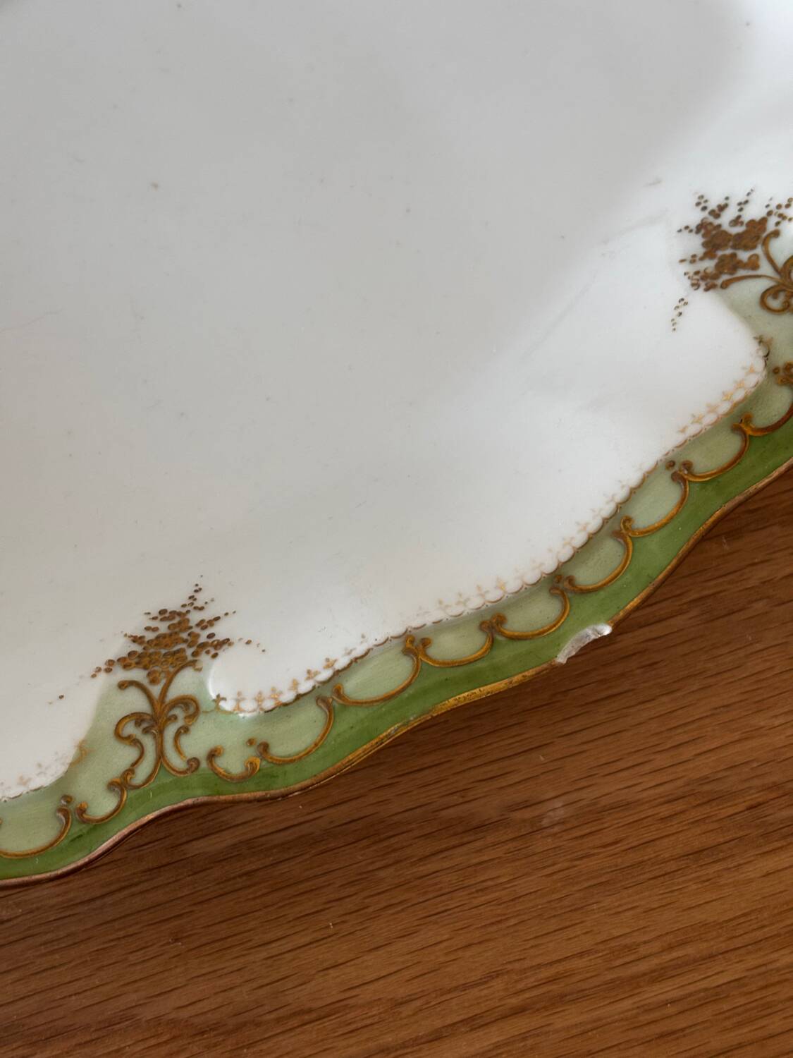 Vintage serving dish with green and gilt defects, Limoges porcelain