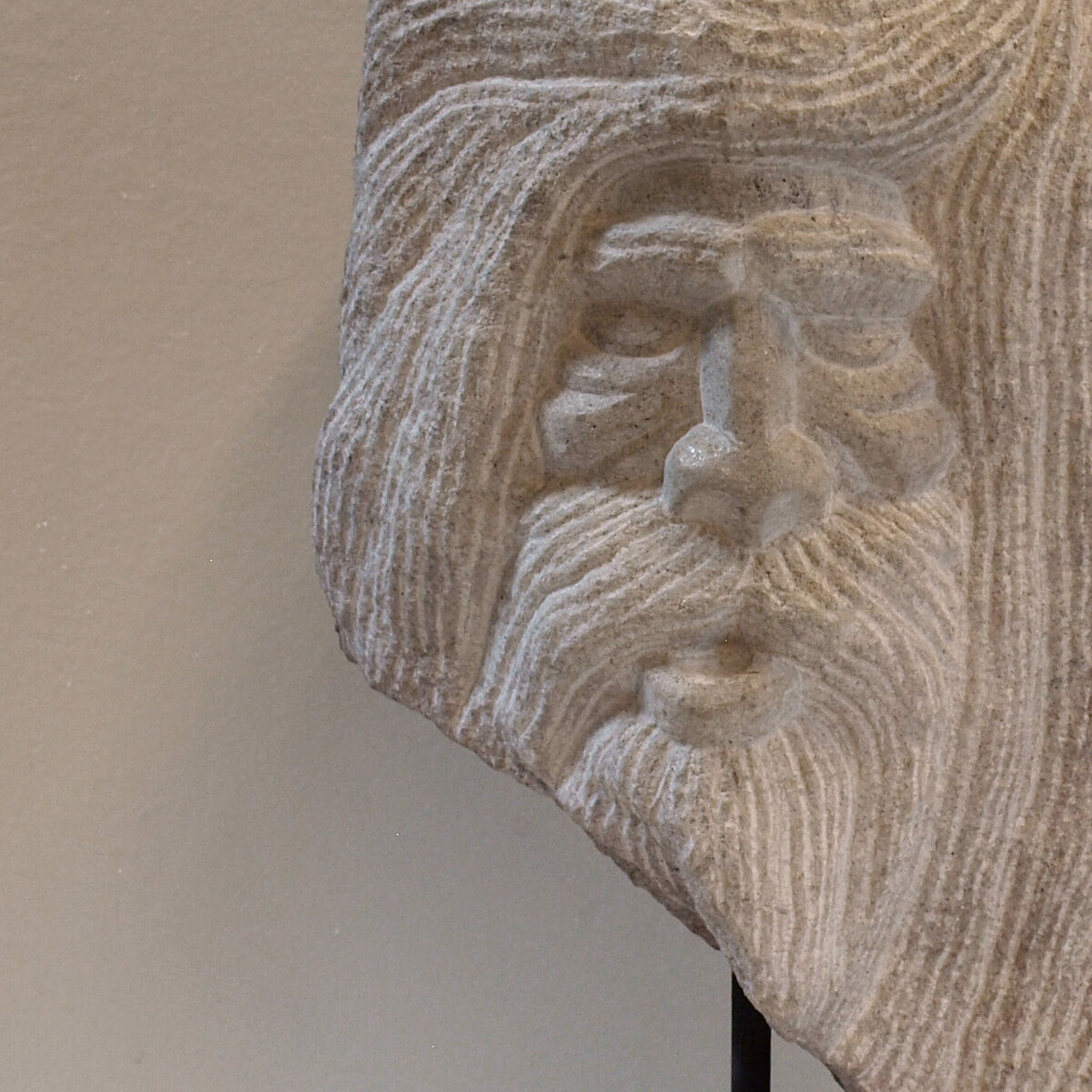 Carved stone head sculpture