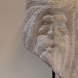Carved stone head sculpture