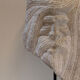Carved stone head sculpture