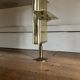 Wall-mounted and modular bookcase in lacquered brass, mirrors and smoked glass by Mahey, Design 1970