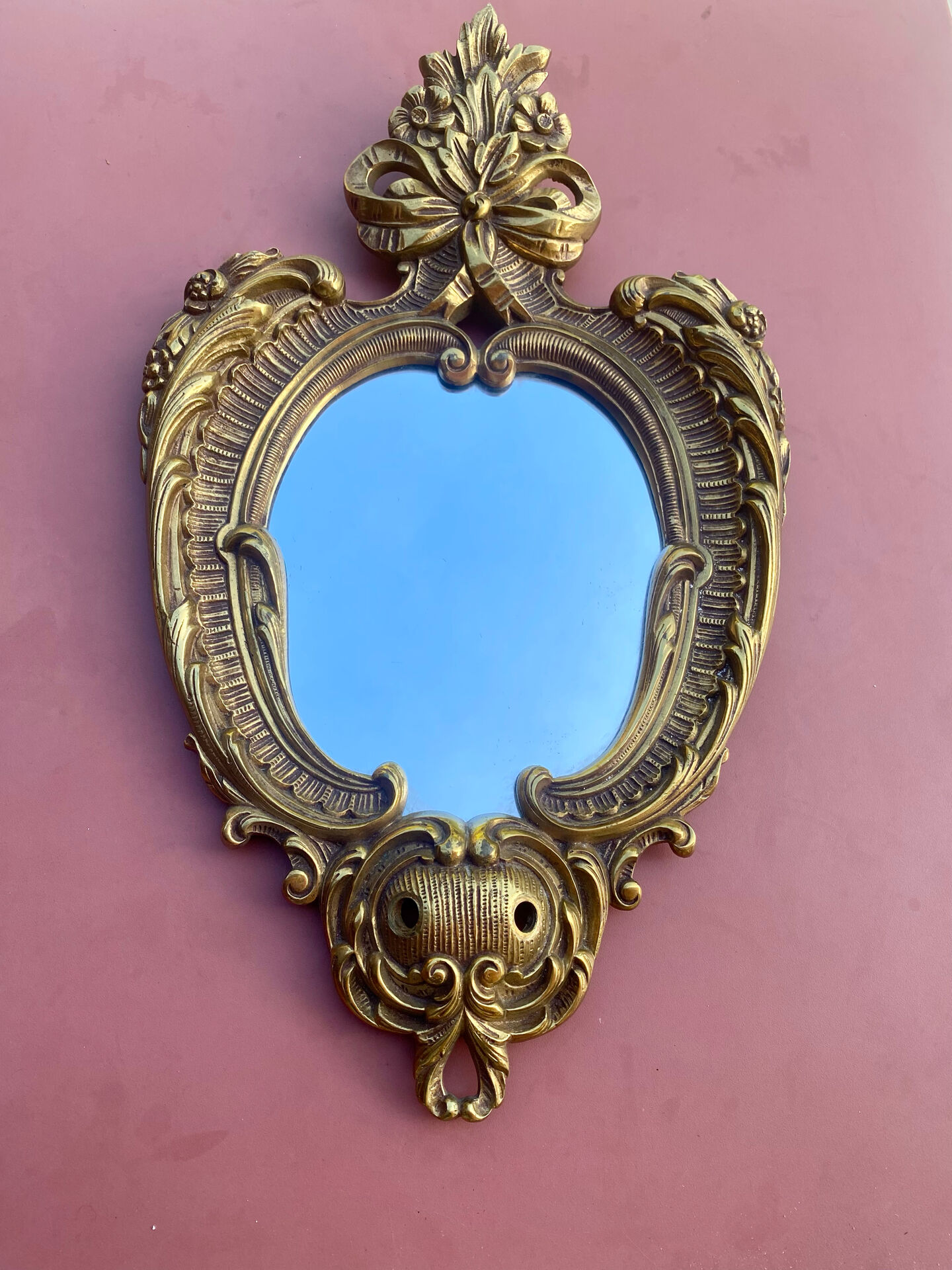 oval decorative wall mirror in Louis XV style