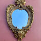 oval decorative wall mirror in Louis XV style