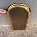 Antique brass fireplace screen from 1920, vintage spark guard.