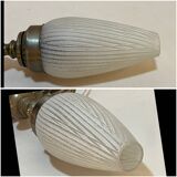 Old bronze or brass table lamp from the early 20th century with white streaked flame glass globe