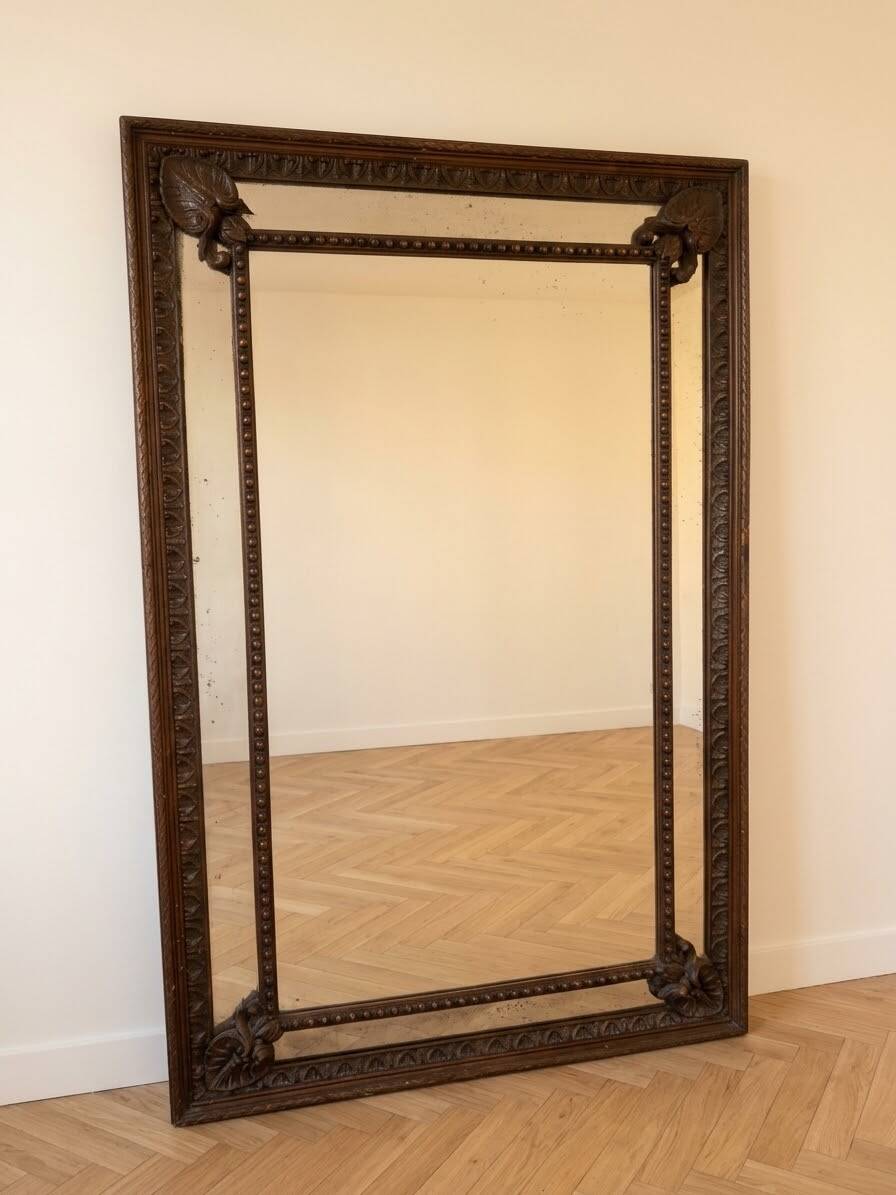 Large antique mirror in carved wood