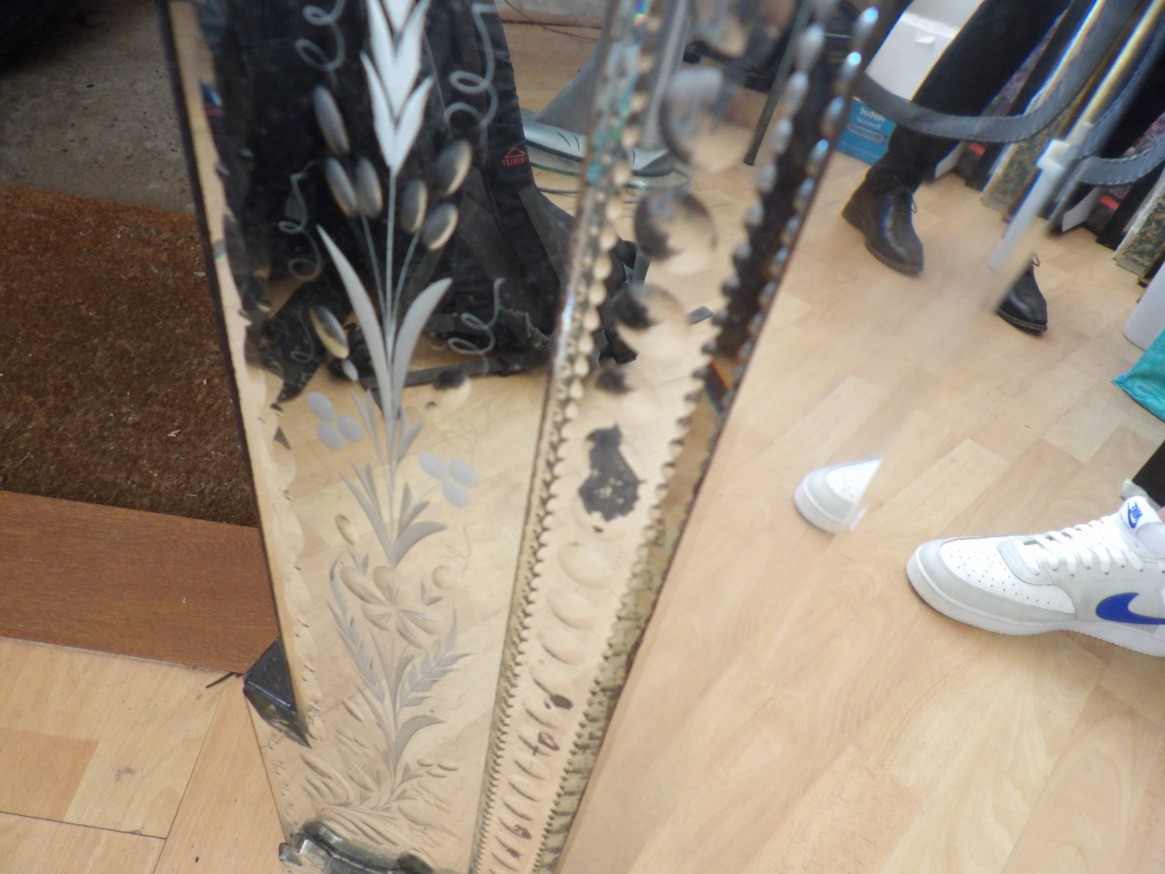 Richly decorated Venetian mirror