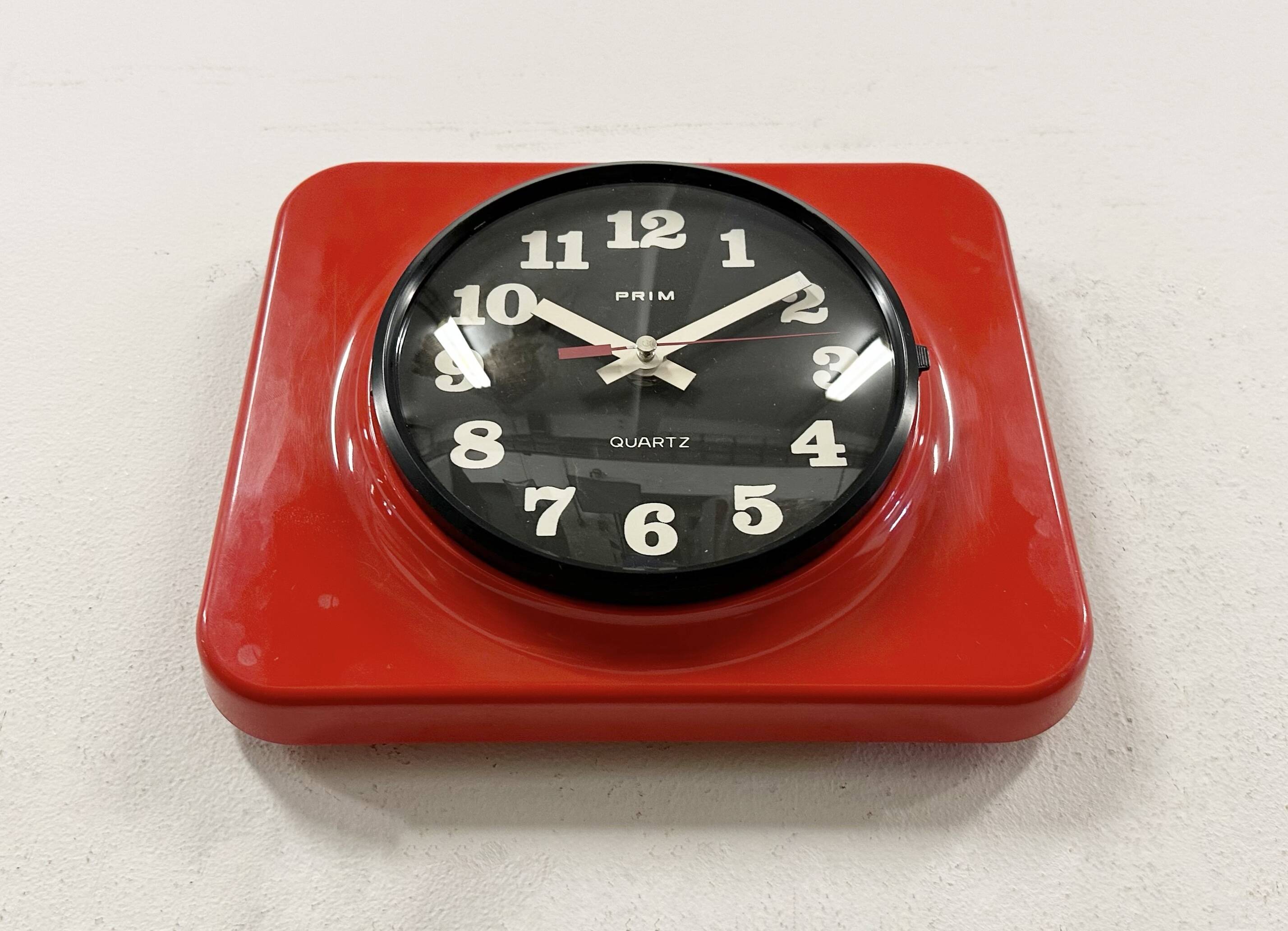 Vintage red bakelite wall clock from prim, 1970s