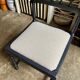 Black turned wooden chair and ivory cotton.