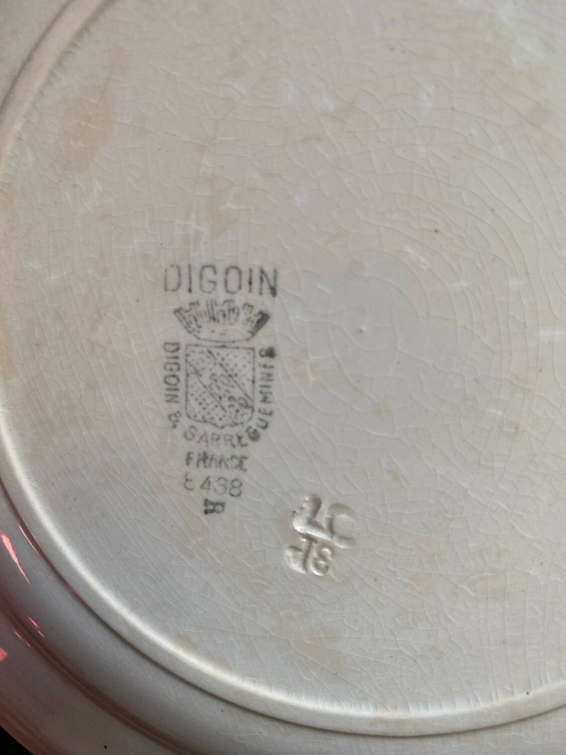 3 flat plates in ironstone with a floral green border.