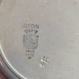 3 flat plates in ironstone with a floral green border.