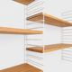 Tomado wall unit with wooden shelves by A. Dekker