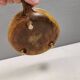 Small ceramic bowl with handle, in golden colours. Danish 1960-70s