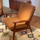 Vintage Scandinavian armchair "Theodor" in terracotta boucle.
