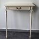 Two-legged wall console in Louis XVI style, painted wood.