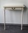 Two-legged wall console in Louis XVI style, painted wood.