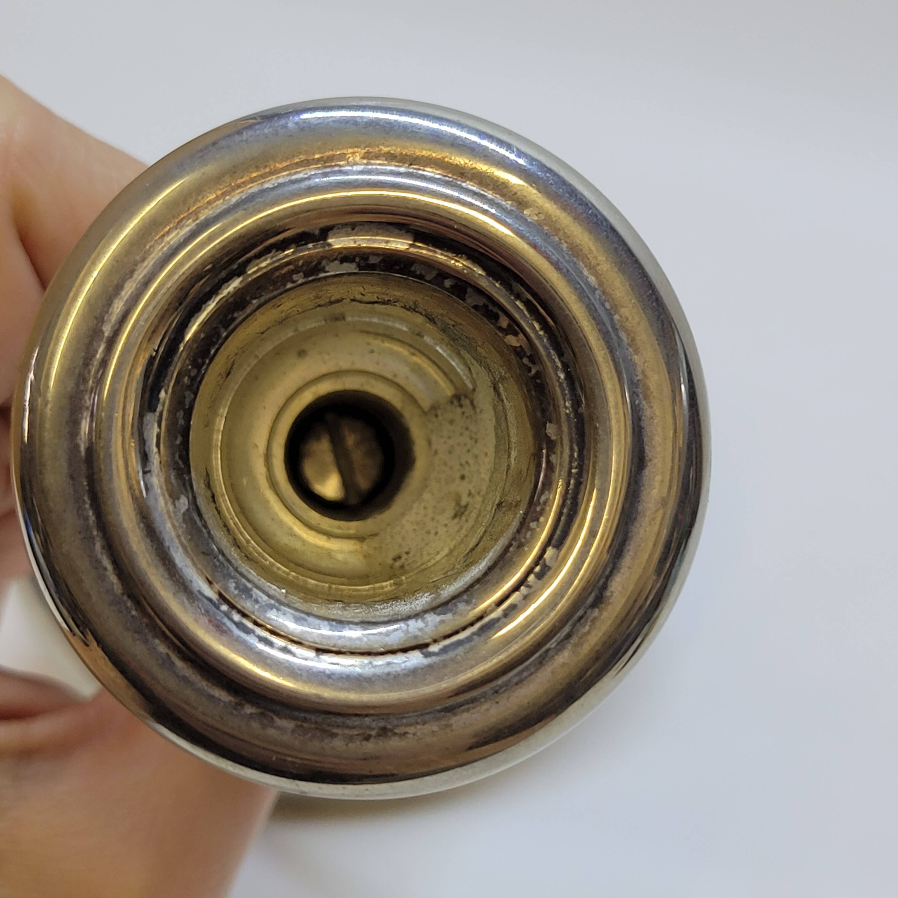 Old candle holder in silver metal