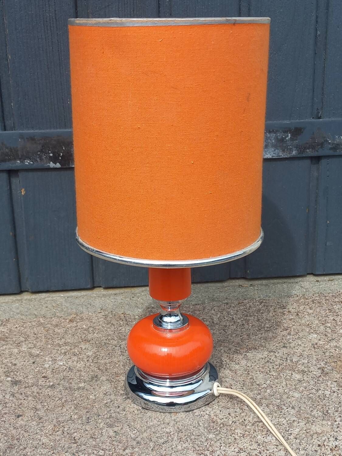 Designer lamp from the 70s in chrome metal and orange lacquered wood