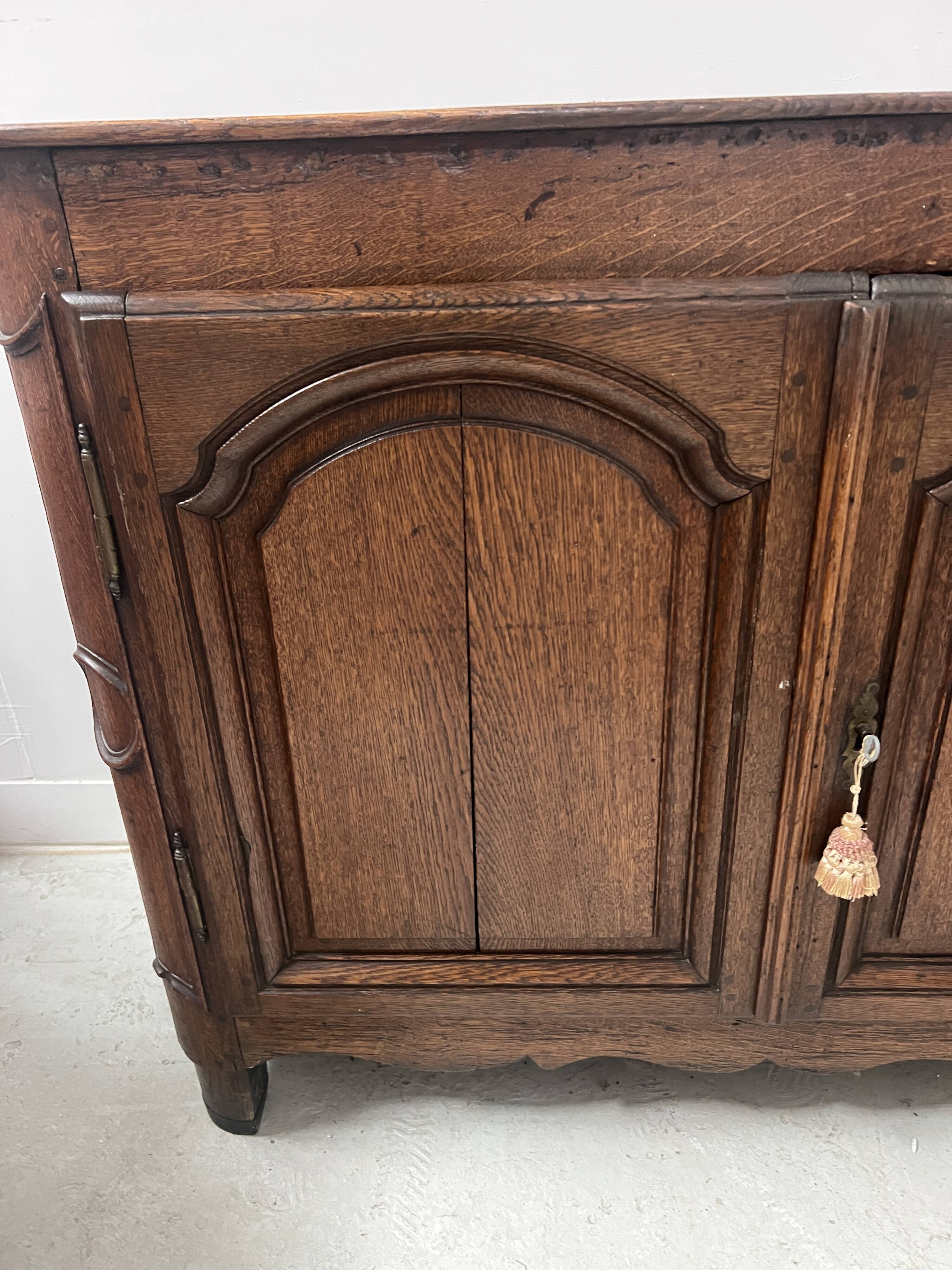 Two-door buffet in solid oak, Louis XIV style, 18th century.