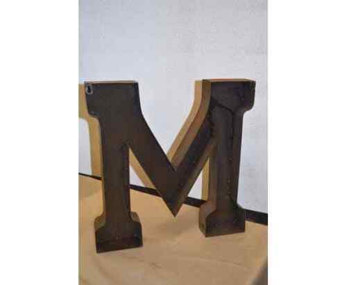 Industrial iron letter "M"