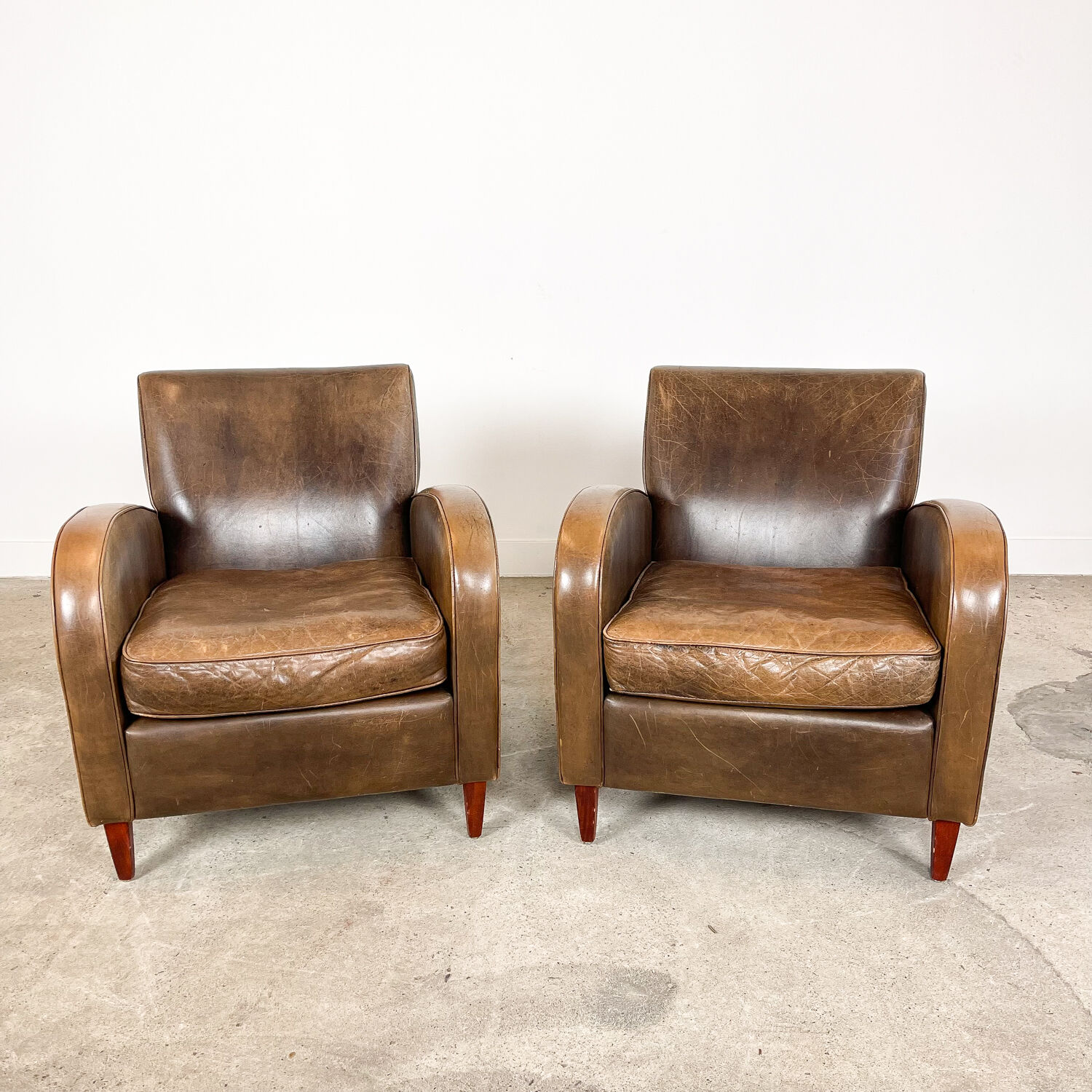 Set of two vintage leather wagon wheel armchairs Haarle