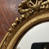 Oval wall mirror in baroque gilded plaster frame 29x20cm