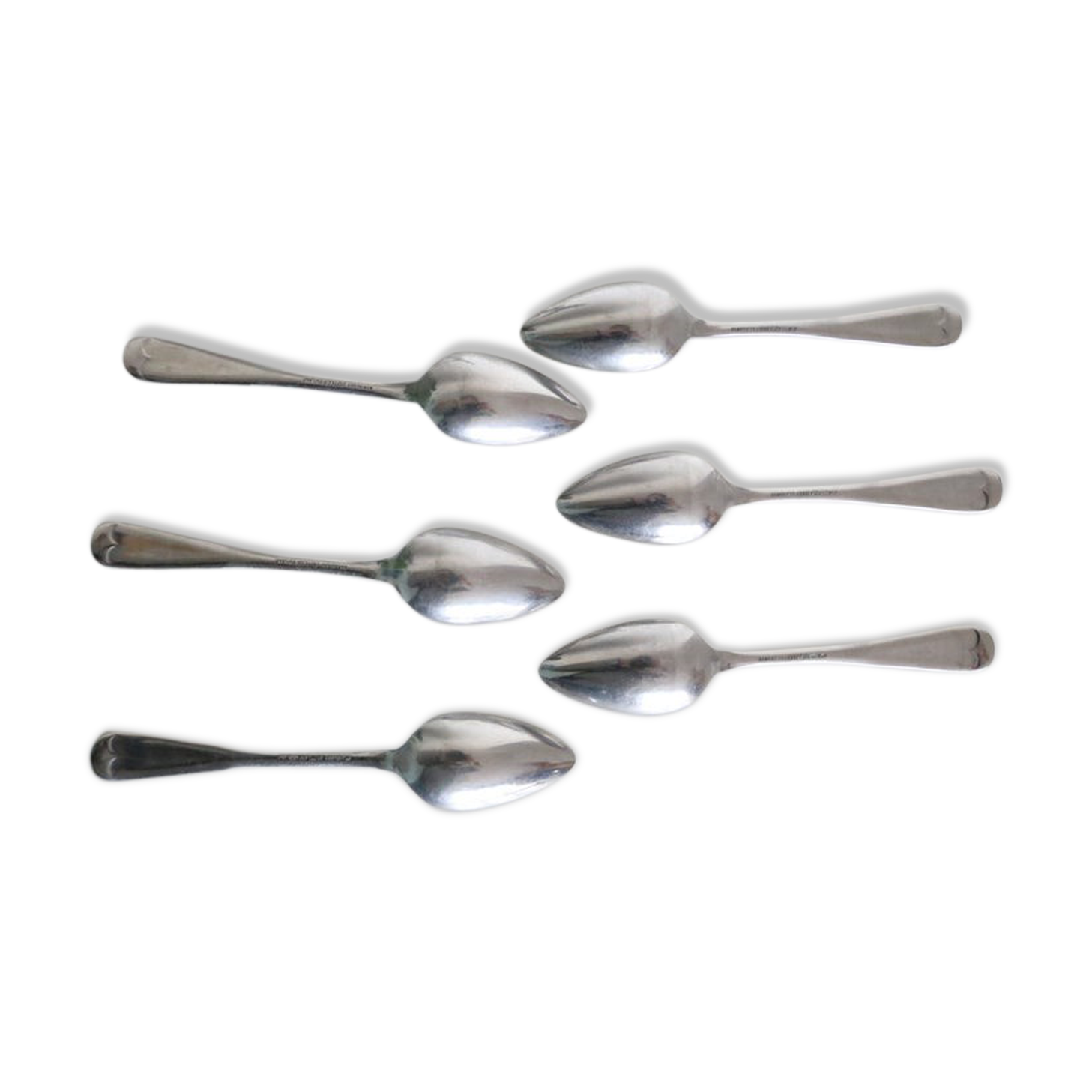 Serving small silver metal notched spoons