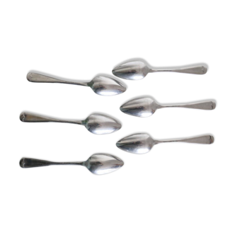 Serving small silver metal notched spoons