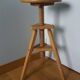 Tripod stool with a screw.