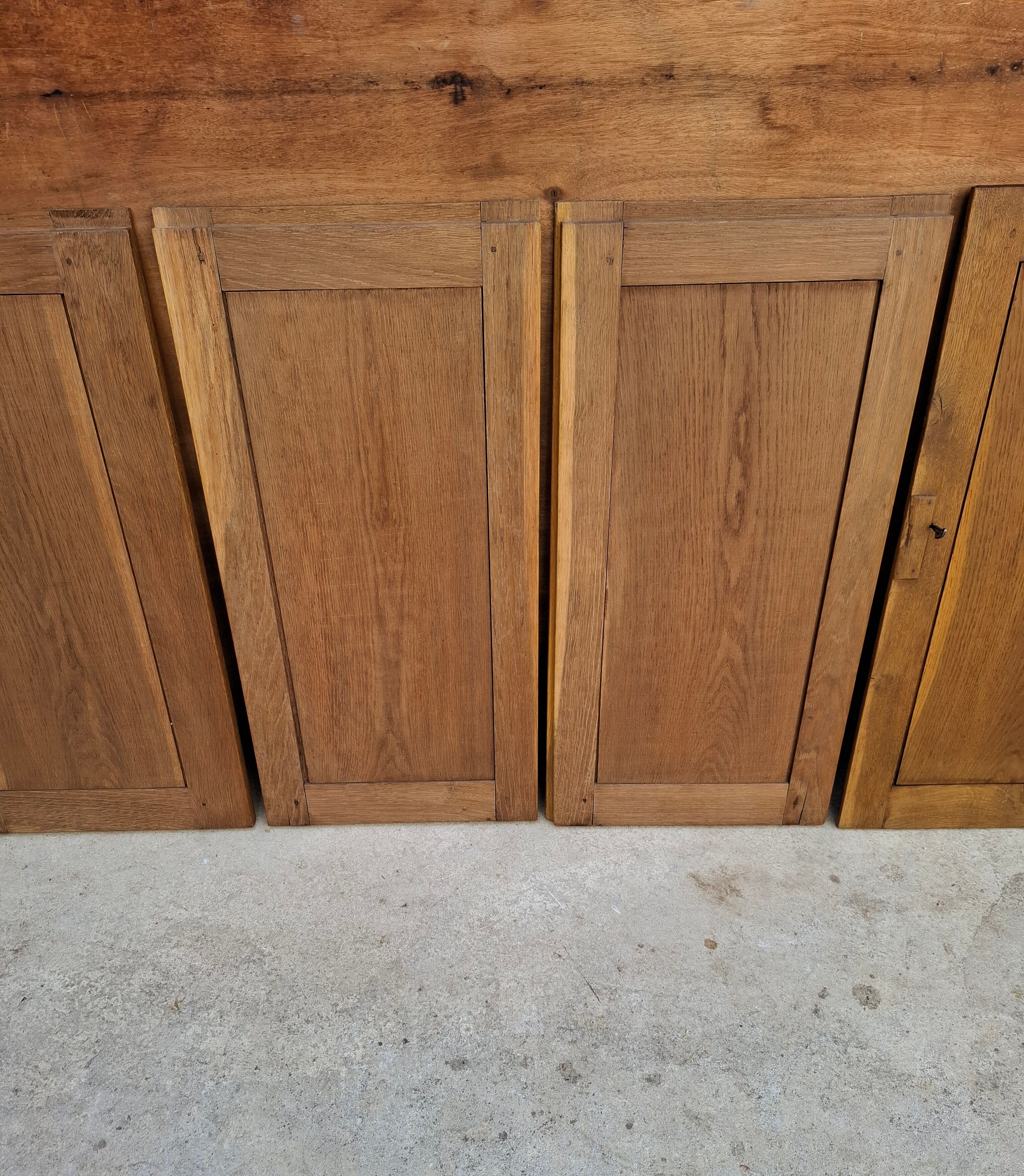 Oak workshop furniture with sliding doors.