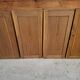 Oak workshop furniture with sliding doors.