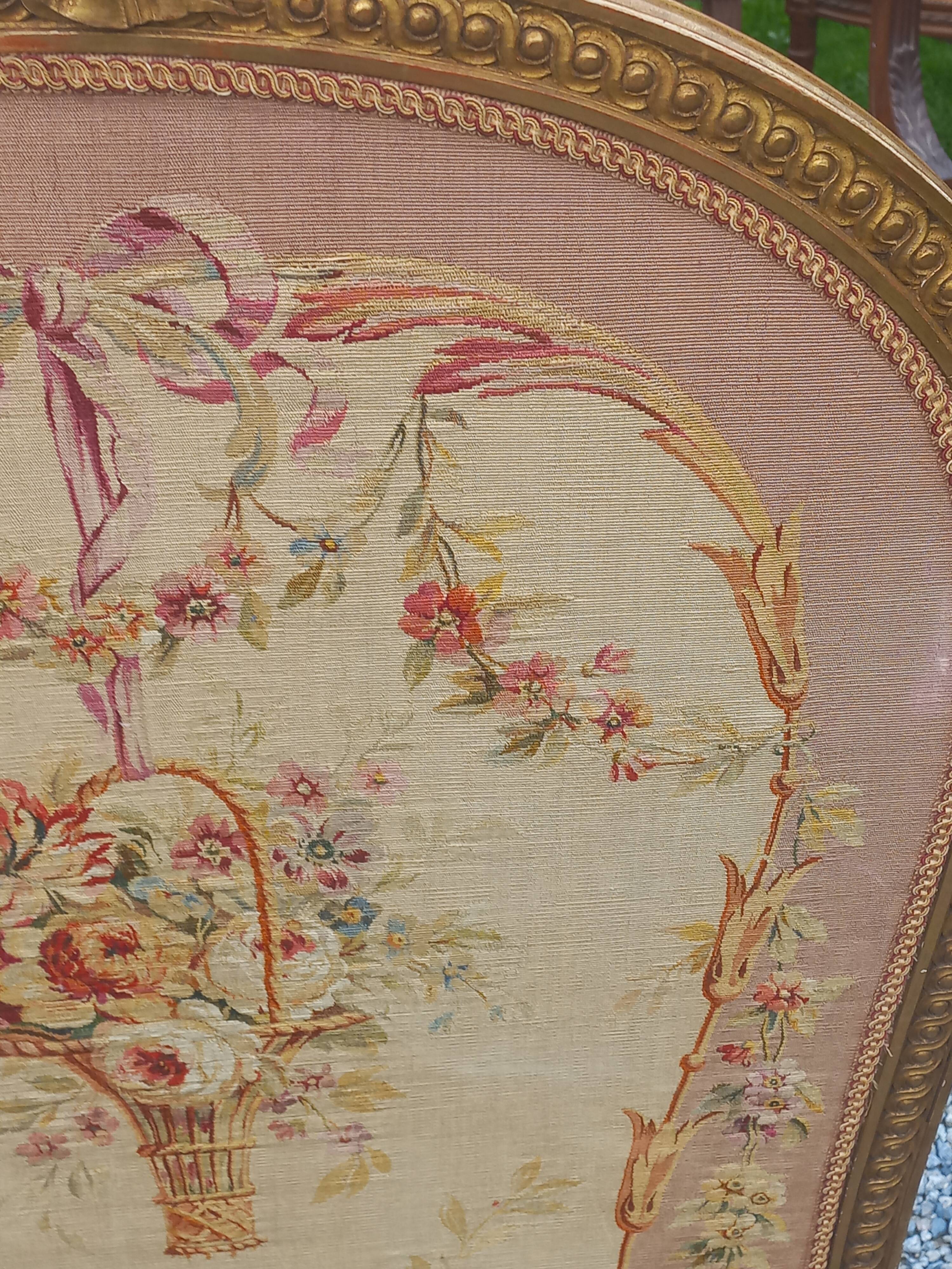 Golden wooden fireplace screen and Aubusson tapestry, 19th century.