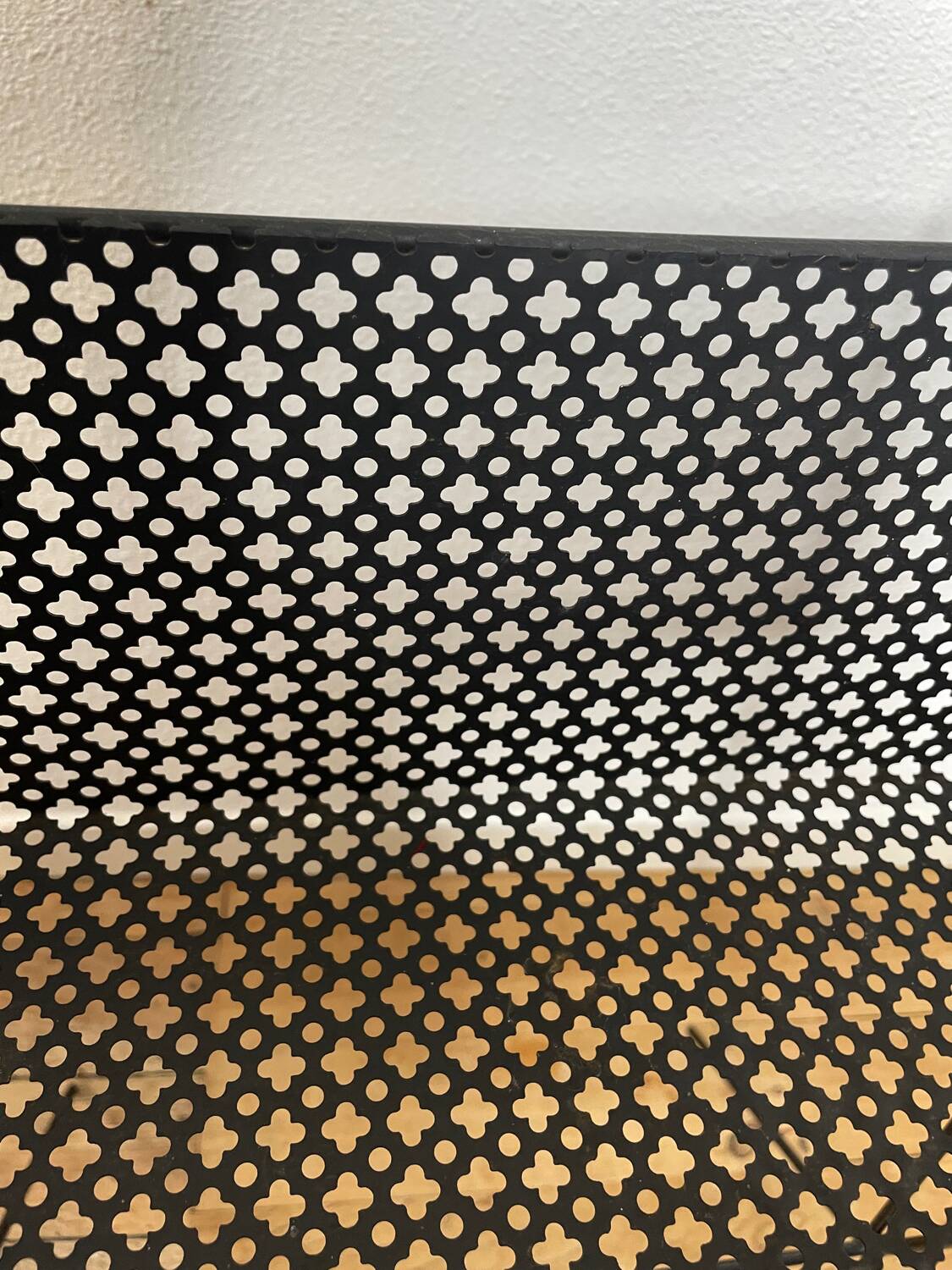 1950s black perforated metal planter in the style of Mathieu MATEGOT